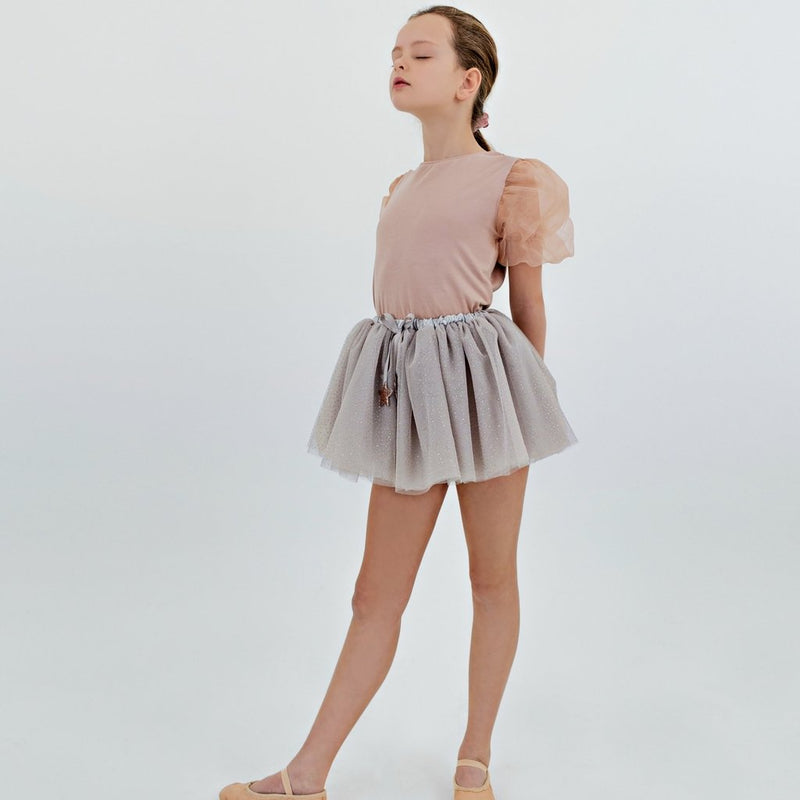 10 year old dancing in the grey sparkle gold glitter dot and gold stars tutu by Mimi and Lula and Crane and Kind 
